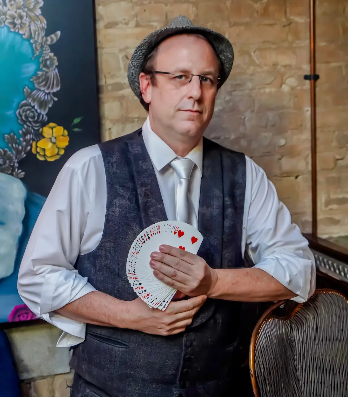 Eric the Magic Guy holding cards